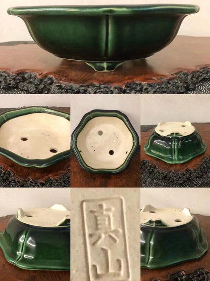 Dark green glazed ceramic bonsai pot with octagonal rim and three drainage holes.