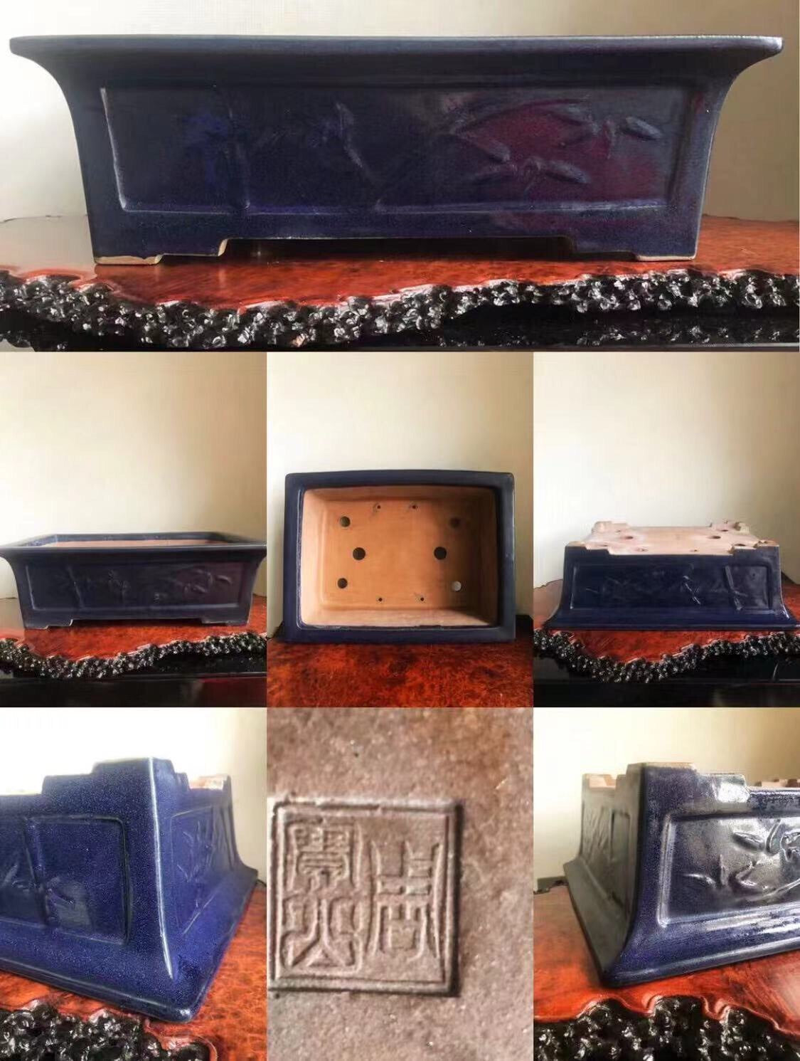 Dark blue glazed rectangular pot with carved floral design and square base stamp.