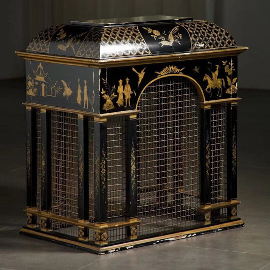 Black lacquered cabinet with gold painted scenes and wire mesh panels.
