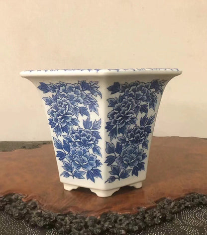 White ceramic pot with blue peony pattern, square shape, glossy finish.