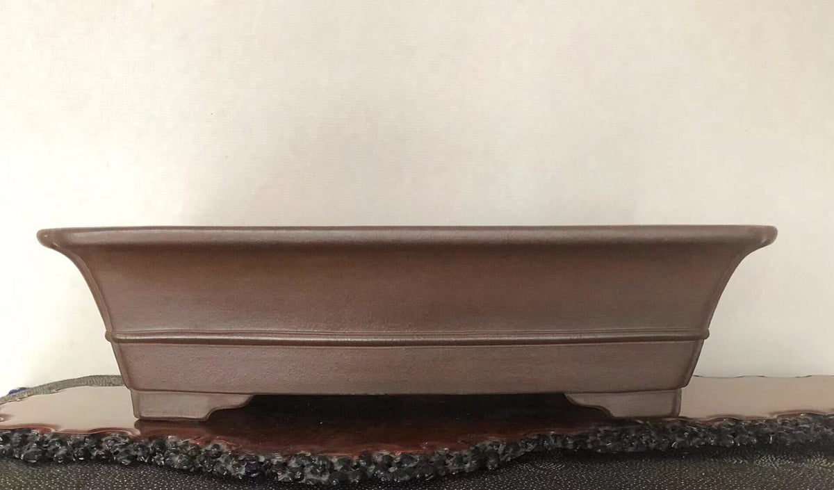 A matte brown rectangular pot with gently curved sides and a subtle rim.