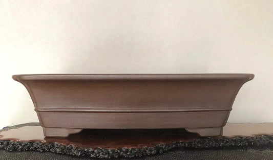 A matte brown rectangular pot with gently curved sides and a subtle rim.