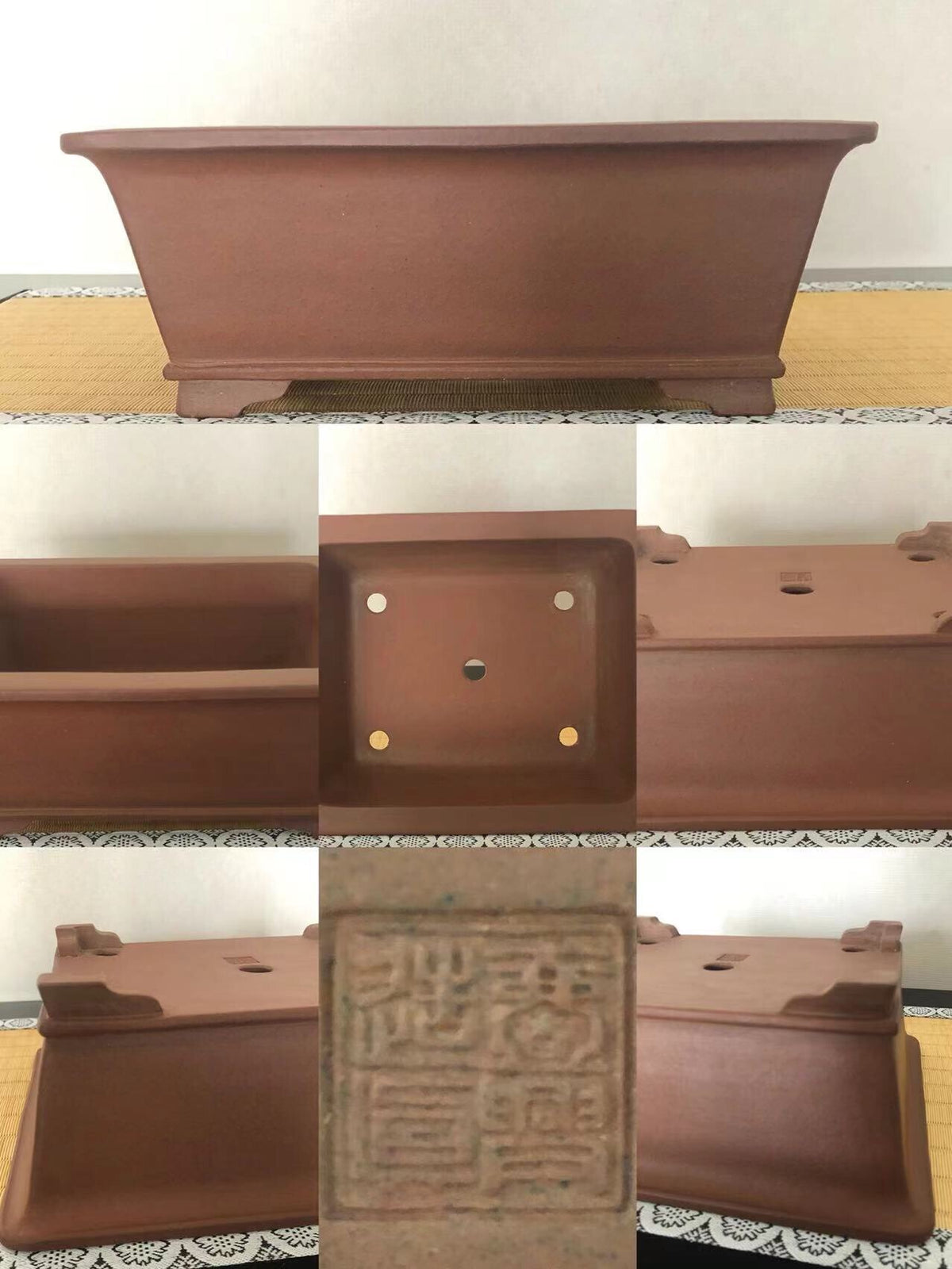 A matte brown rectangular pot with four footed legs and a central stamped seal.