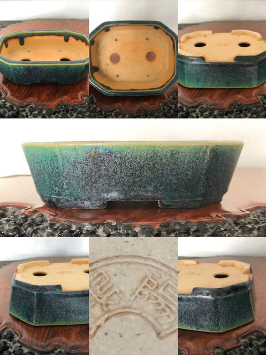 Octagonal glazed pot with green and black mottled glaze, unglazed tan interior, and stamped mark.