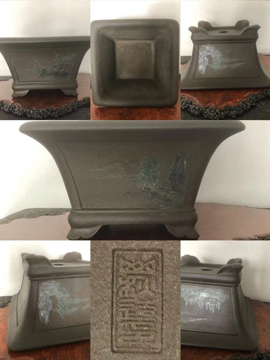 Dark grey glazed square pot with painted landscape and raised seal mark.