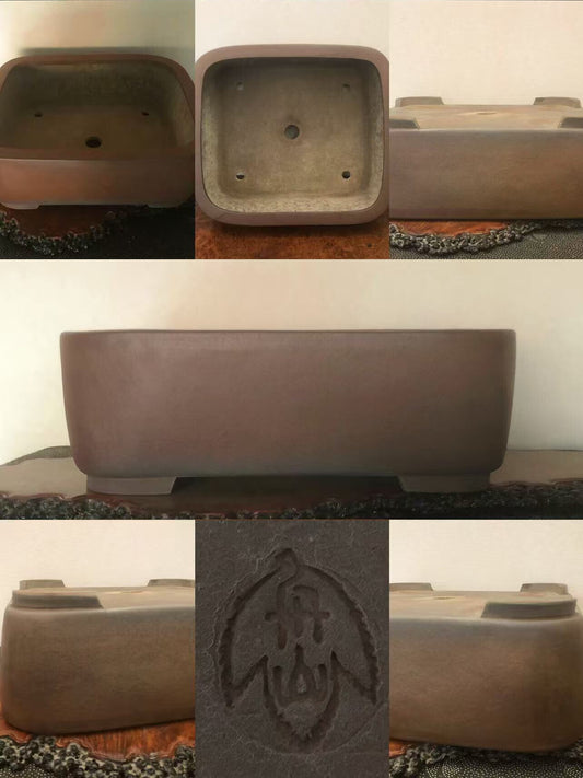 A matte brown rectangular pot with a carved leaf mark on its base.
