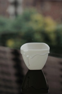 Ando Ryosuke milk-cap running-glaze white porcelain cup — piece 2 of 2